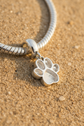 Dangling paw print charm